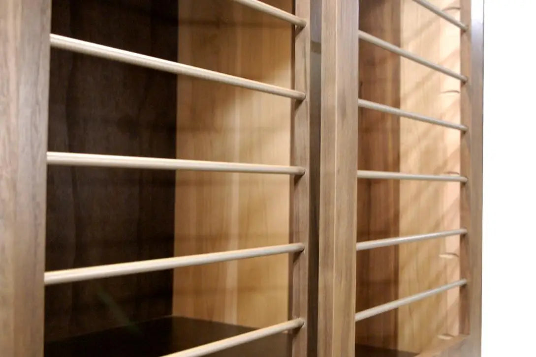 Custom Modern Dog Crate furniture in solid maple and walnut hardwood_close-up of sliding door and smooth horizontal steel bars in Champaign color finish