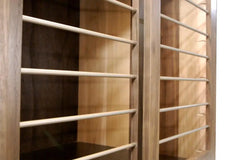 Custom Modern Dog Crate furniture in solid maple and walnut hardwood_close-up of sliding door and smooth horizontal steel bars in Champaign color finish