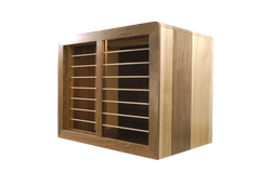 Custom Modern Dog Crate furniture with sleek rounded waterfall edge. front right cabinet view shown in solid maple and walnut hardwood with sliding door and smooth horizontal steel bars in Champaign color finish